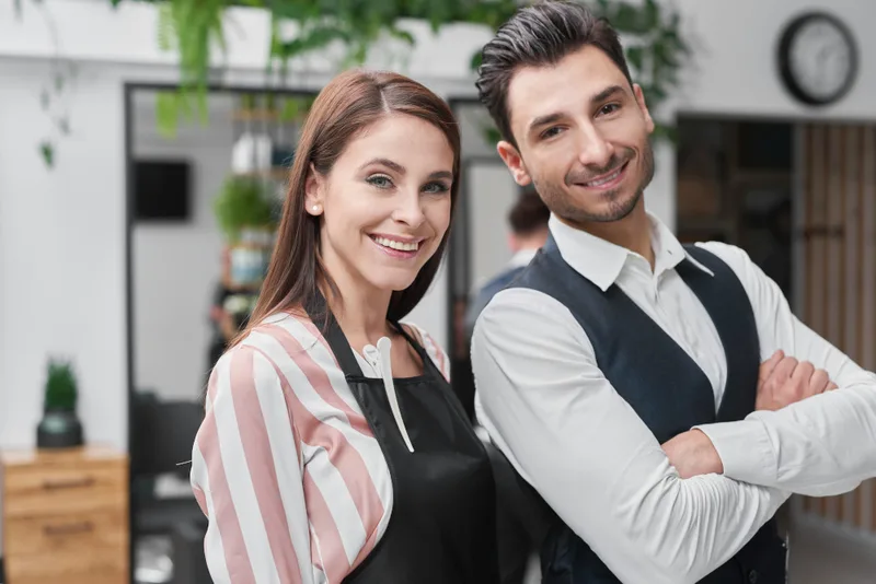 Smiling small-business team in their salon
